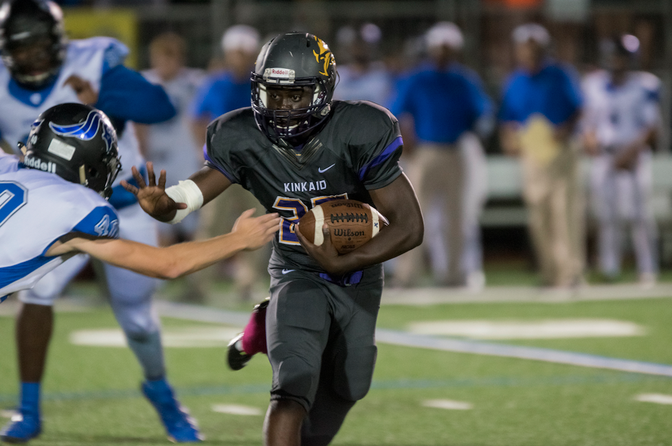 Marquis Hubbard (10) stiff-arms an EHS defender. Photo by Halle Brazda.