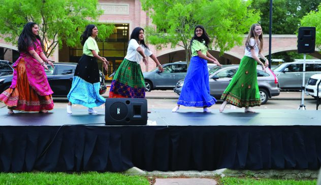 Members of the India Club perform a traditional dance.