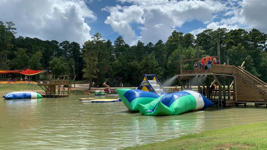 Peer mentor Chris Stallings (12) flips off a water launch pad at Camp Cho-Yeh last Saturday.