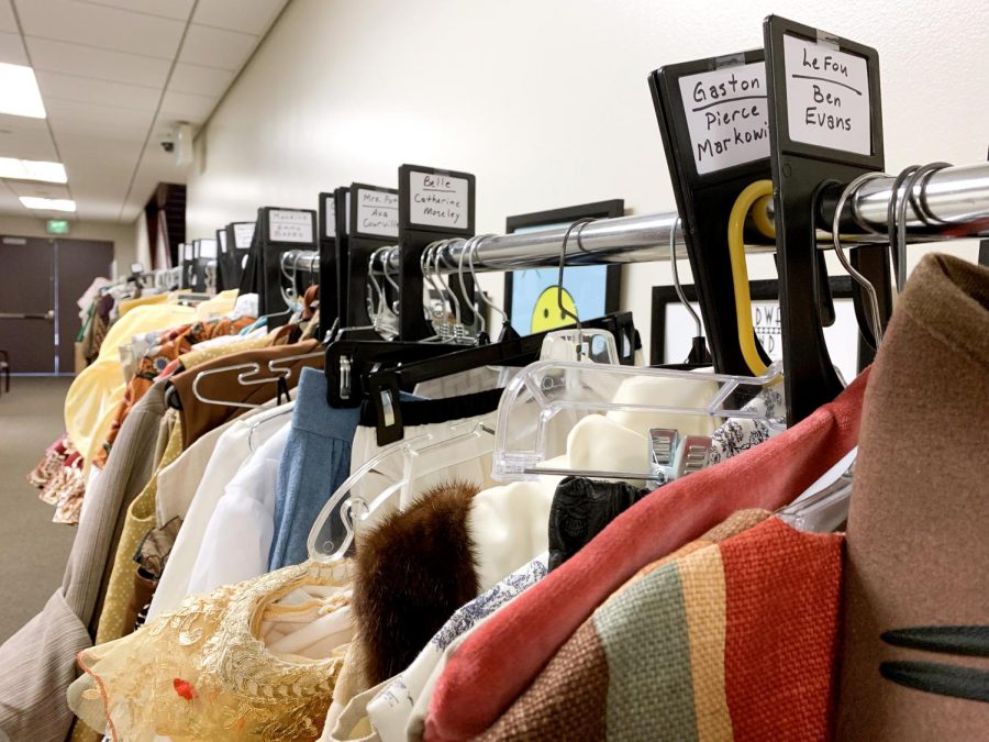 Costumes for performers line the hallway in preparation for the staging of Disney's "Beauty and the Beast."