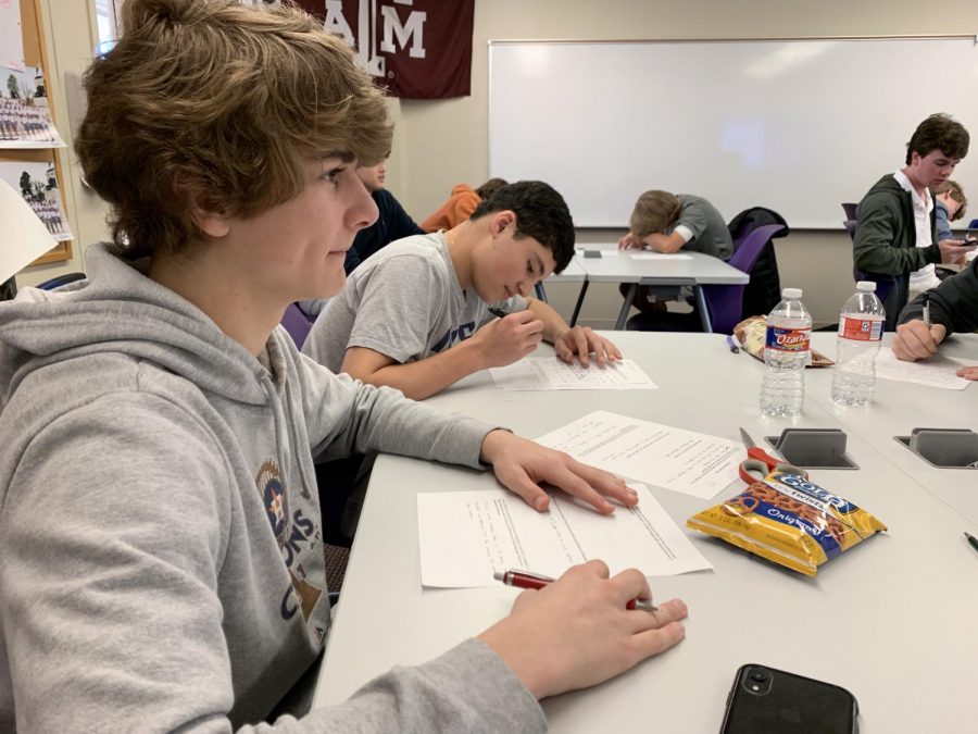 Jack Randell, a sophomore, ponders the movie "Lonesome Dove" while sophomore Ben Shaper answers questions on a quiz.