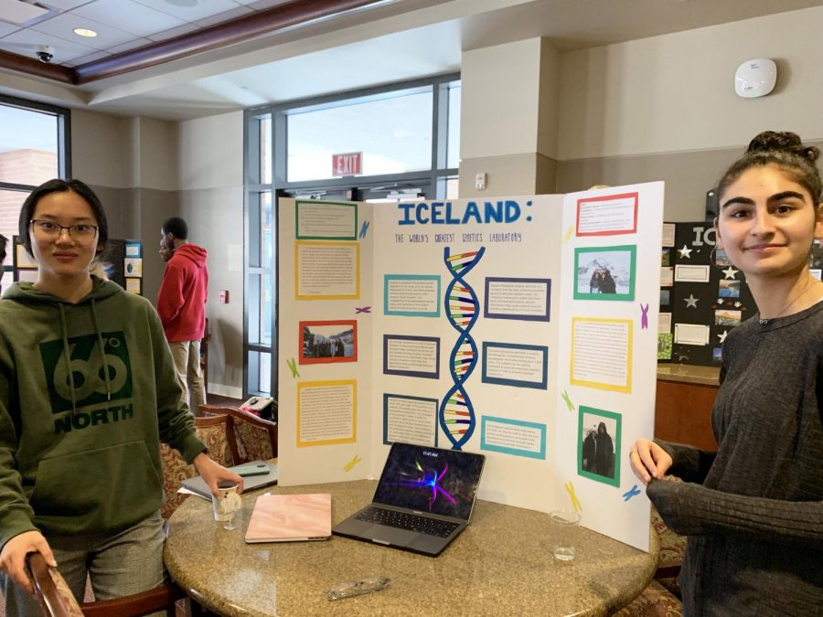 Juniors+Alison+Zhang+and+Zoe+Price+share+a+poster+presentation+about+a+genetics+laboratory+in+Iceland.