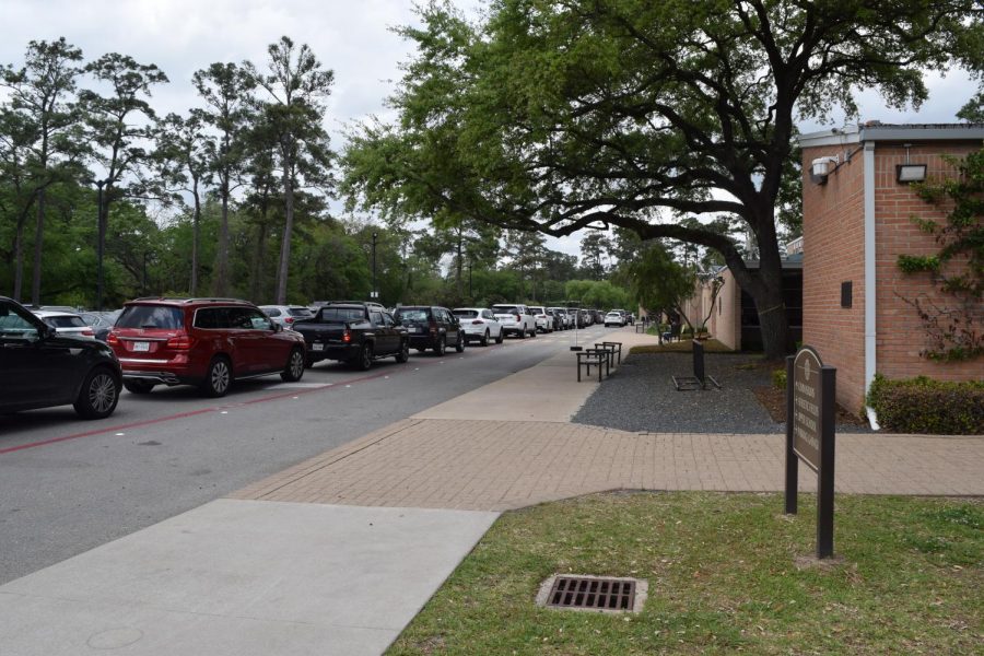 Middle school parents line up for carpool on a Tuesday afternoon.