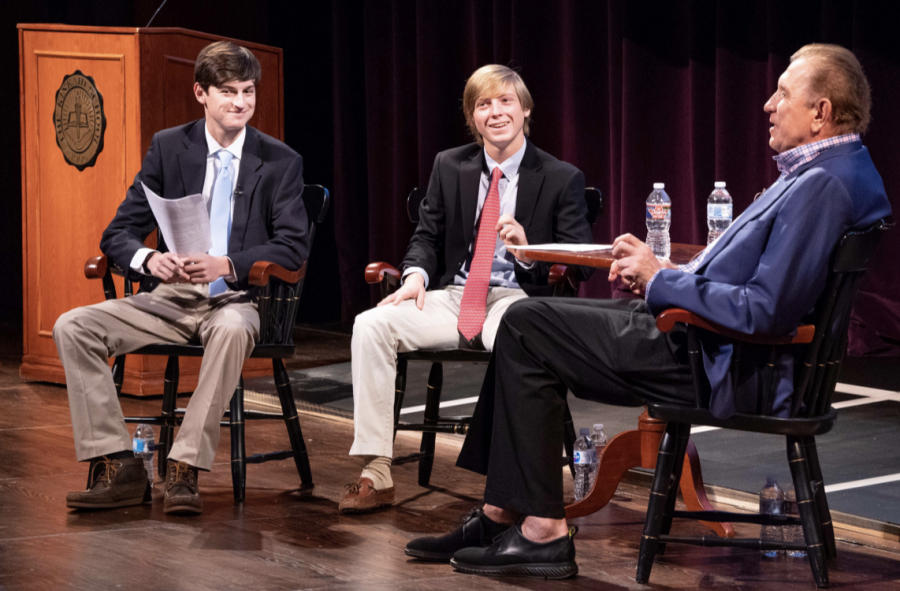 Elliott Crantz and George Kinder speak with Rudy Tomjanovich on Sept. 21. Mr. Tomjanovich's visit to campus was an instance where professional dress was required.