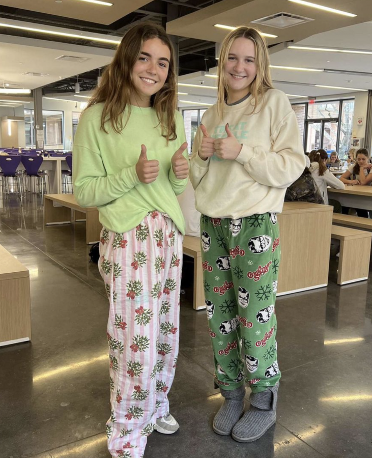 Sophomores Marion Fertitta and Helena Heath pose in their pajama outfits. 