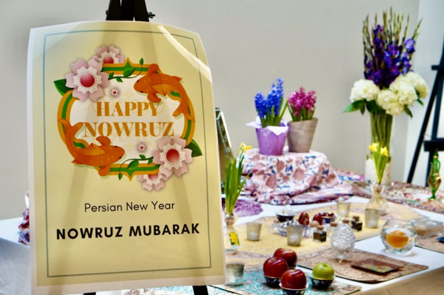 As students walk through the hallway in the student life building, they see the table celebrating the holiday, Nowruz, the Persian New Year. 