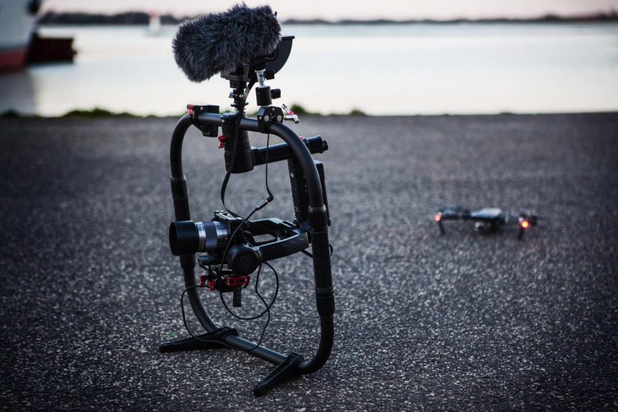 A film setup with camera, cage and drone.