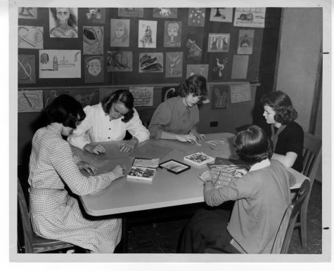 A capture of the Upper School Art Club c. 1940 working on individual projects.