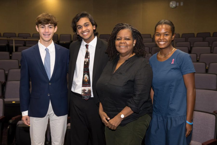 Juniors Henry Wizel, Eshaan Mani and Ava Winn pose with Prof. Annette Gordon-Reed before giving her a tour.