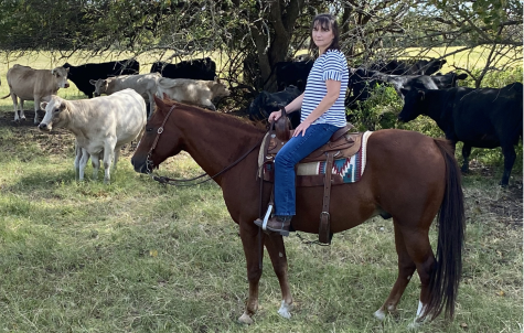 Dr. Susan Wheeler, who teaches math in the Upper School, rides a horse and greets others, including a baby goat, on her family farm near College Station. 