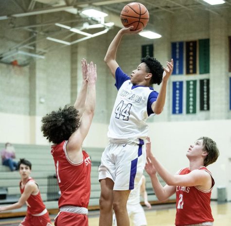 A capture from a recent game of the boys varsity basketball team.