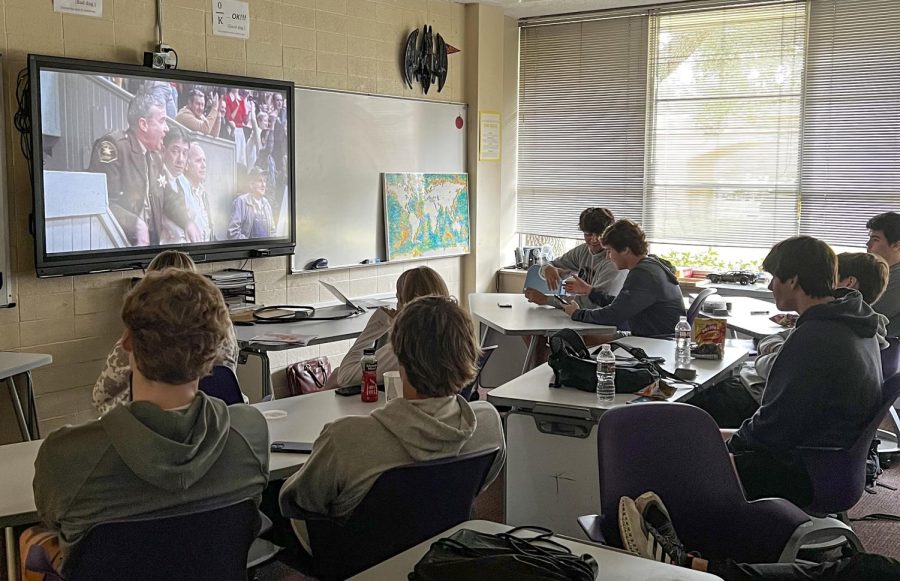 Students in "Classic Sports Movies" watch a scene in the movie "Hoosiers," which is about a coach who earns  a championship bid with his high school basketball. The class was taught by Mr. Cushman Laurent, Upper School math teacher.