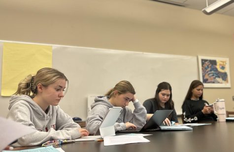 Sophomore Reese McMullen, junior Katie Whiteley, sophomore
Emerson Heath and  freshman Ellison Anderson read over notes in their journal to get ready for discussions in the Women in Film class. The class was taught during the Interim Term by Mrs. Kate Lambert, Upper School English teacher, and Ms. Frances Limoncelli, theatre teacher.
