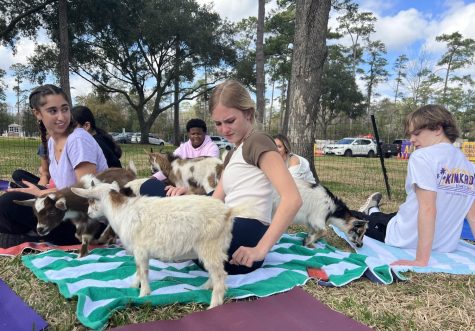 Sophomore John Osborne, right, appears with students who tried goat yoga during Interim Term.