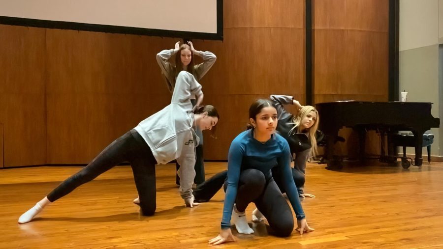 Freshman Beyli Shah leads a dance she choreographed with the help of freshman Anna Busa and sophomores Allison Whitman and Brisa Perkins in their Inspired Choreography Interim Term class. 