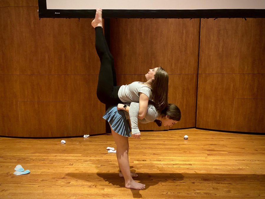 Freshmen Caroline Kubitza and Christine Agrons practice bonding skills during their "Inspired Choreography" Interim Term class. Their teacher, Ms. Anjaly Thakker, who teaches math in the Upper School, reminded them to communicate and balance with each other to perfect their skill.  
