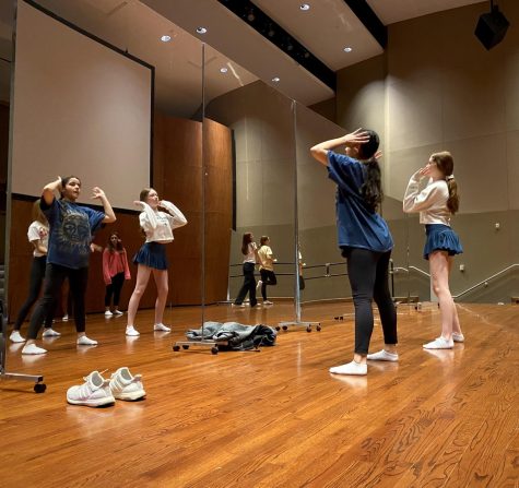 Freshmen Beyli Shah and Anna Busa rehearse dance numbers they choreographed. They finalized their different choreography in the reflection of mirrors during their Inspired Choreography Interim Term Class. 

