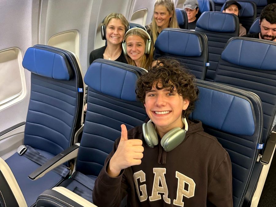 Freshman Henry Wise, the writer, awaits departure on a New York-bound flight to a Model UN Conference along with sophomores Margaret Smith and Molly Dinerstein. Upper School teachers Tamasine Ellis (third row) and Angela Wainright took 25 students to MUN this January.