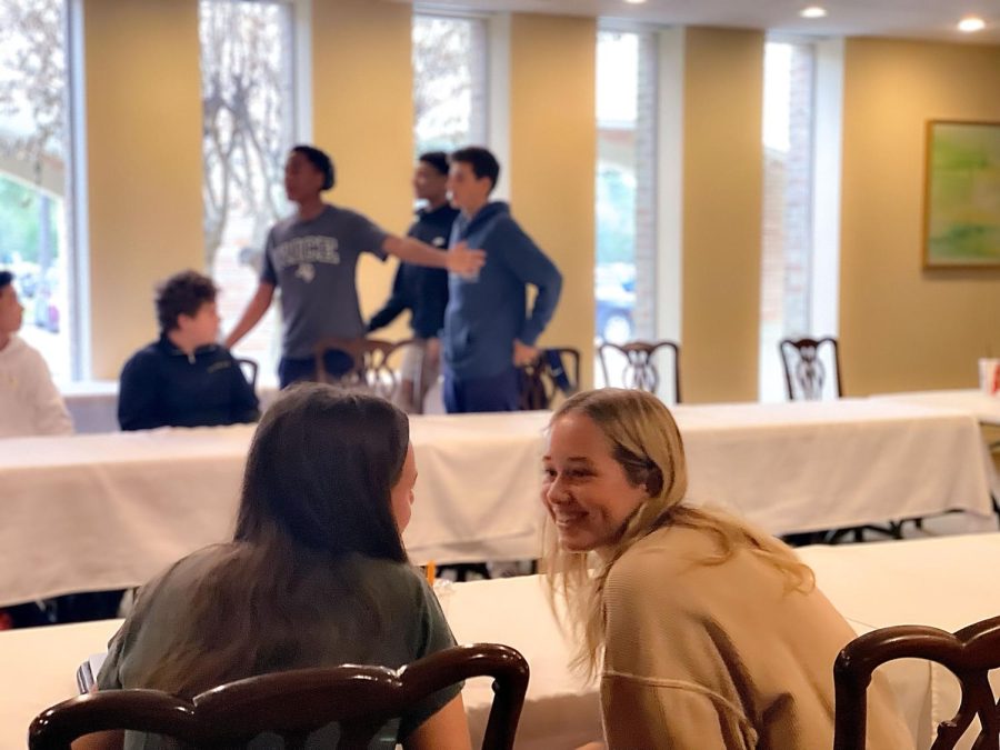 In the class “Beyond The Plate,” sophomores Maddy Billipp and Haylie George spend a little time talking. They waited to be placed into groups for the dish they would prepare for the day. 
