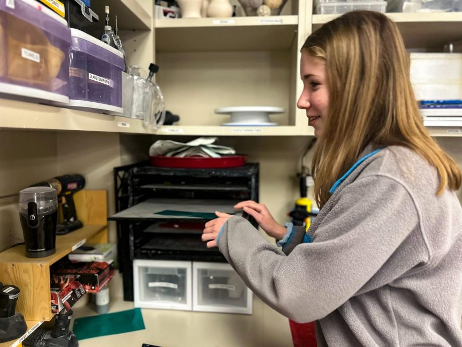 Hayley Alexander, sophomore, puts her  sliver clay charms in a dehydrator so all the moisture gets removed and the silver can be ready for firing. Alexander said she chose to take the "Art for Others" class because she loves art and wanted to learn new styles of making it.