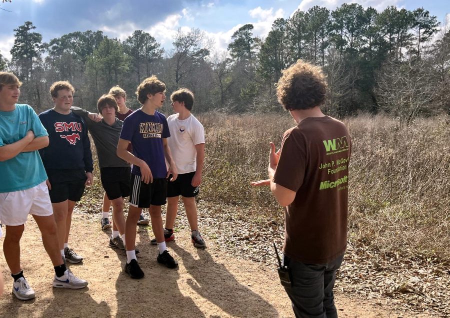 Students listen while a tour guide shares information during a nature walk. Students visited Houston Arboretum Nature Center in the Undiscovered Houston Interim Term class.
