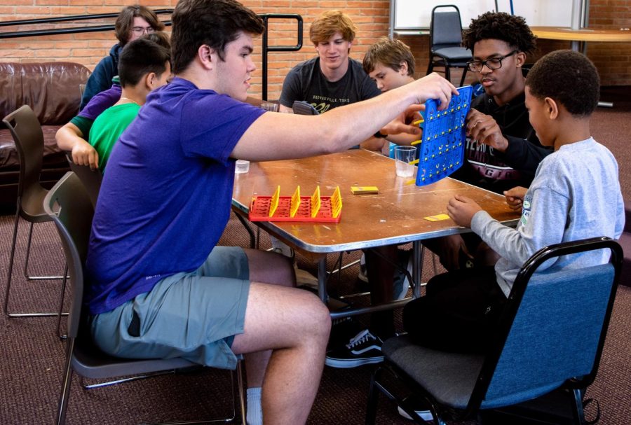 Juniors Oliver Eades and Blake Hicks play Connect 4 with their buddy.