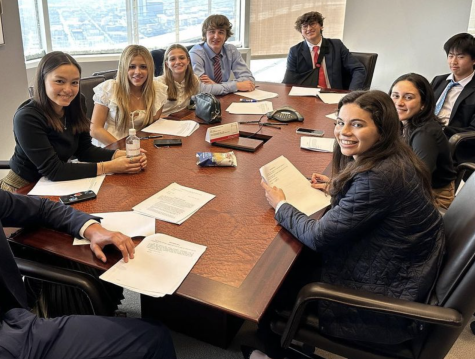 A student committee poses during a jury deliberation.