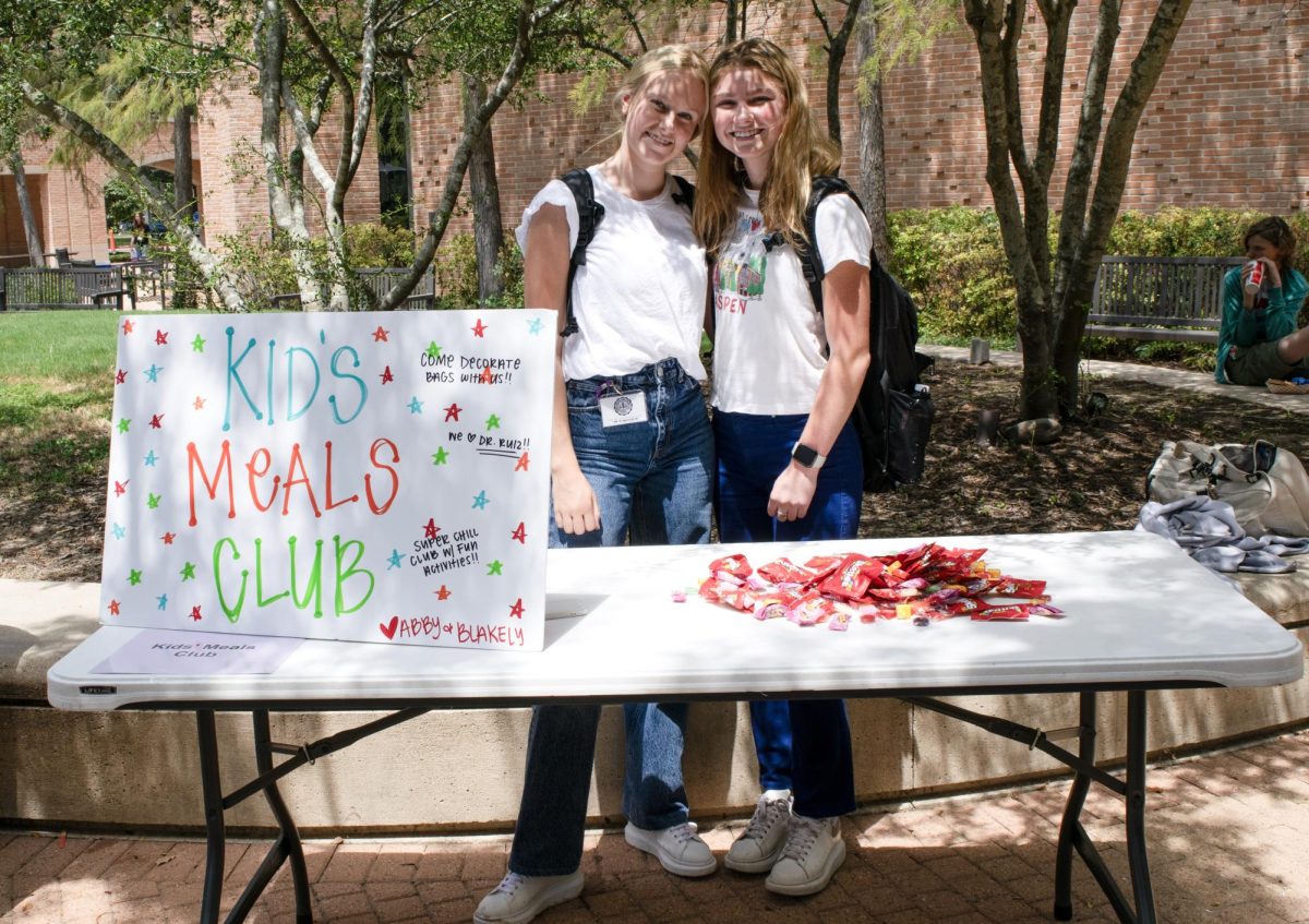 Seniors Abby Bale and Blakely Brown manned the Kids Meals Club booth at Club Fair. Kids Meals makes and delivers free, healthy meals to children; the club works as a liaison with them.