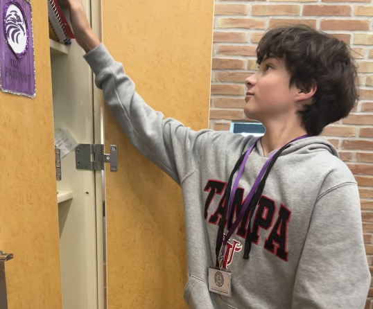 Freshman Lucas Cohen wears a lanyard in order to display his falcon card.