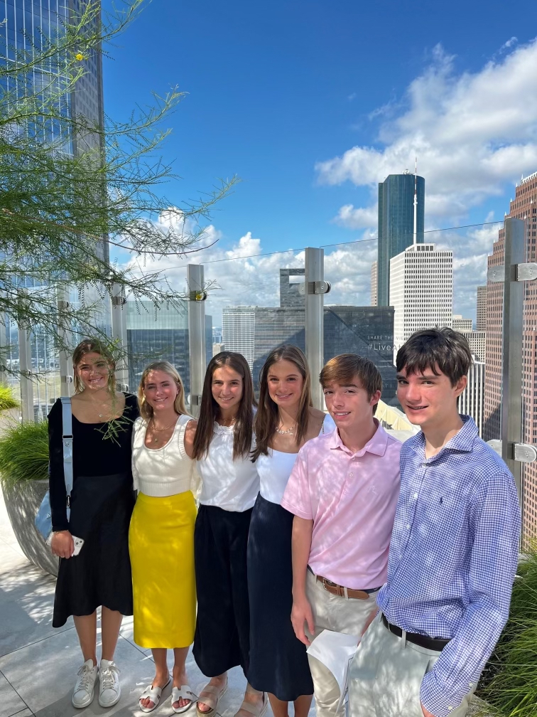 With the Houston skyline draped behind them, seniors Wills Leighton and Ladin Strauss, sophomores Caroline Kubitza, Grace Essalih, Caroline Letzerich, Lindsey Morgan commemorate their time at Hines, a Houston-based real estate firm. They were among the first class of student to go through Kinkaid’s new summer internship program developed by Kinkaid’s Alumni Board Committee.