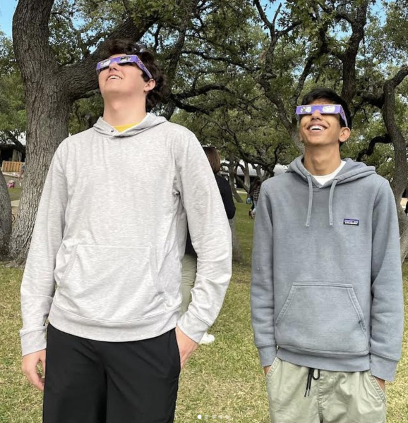 Juniors Sam Ferber and Shaan Dhutia watch the eclipse at St. Marys Hall in San Antonio, TX.