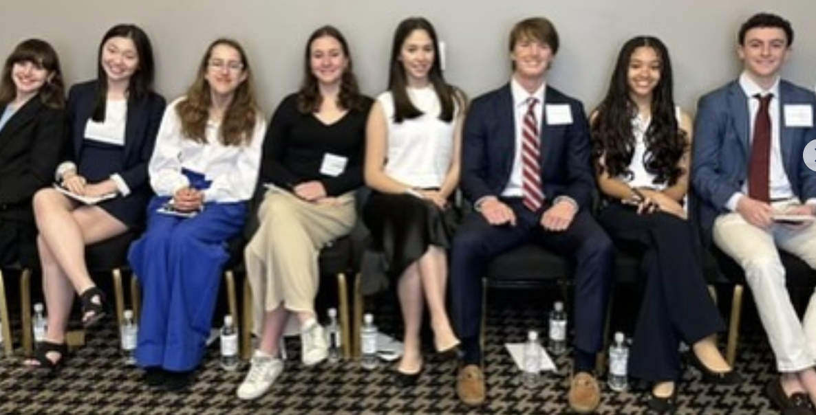 Students pose at Norton Rose Fulbright's mock trial program.