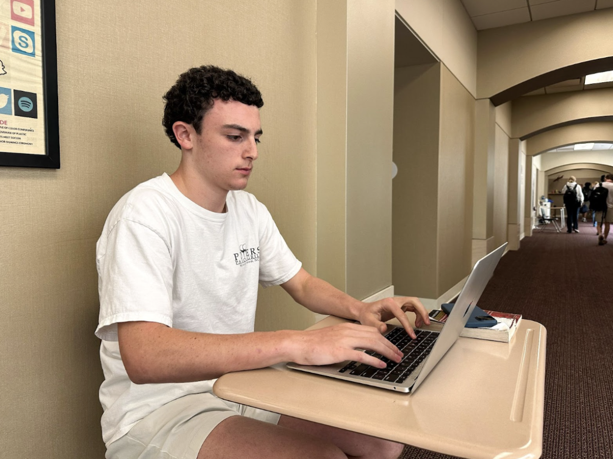 Sophomore Jack Susman diligently working on one of many short stories, each a recognition of the struggles and successes of immigrants. 