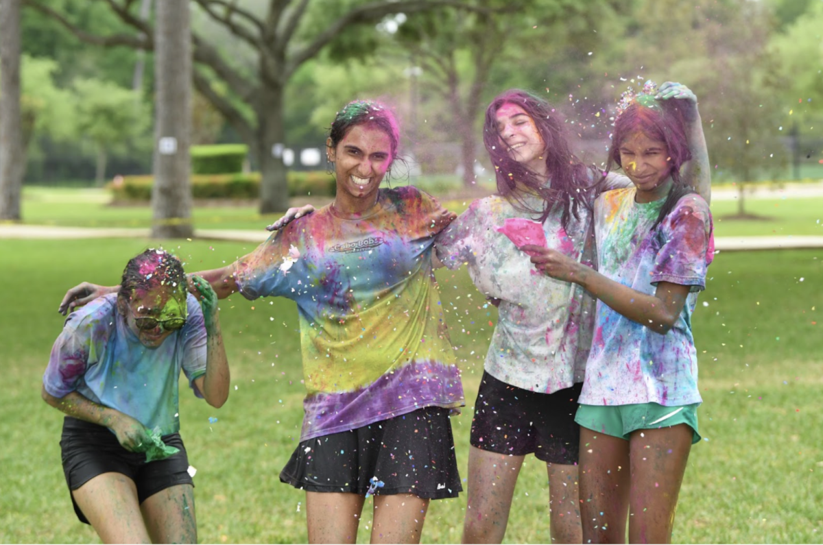 Covered in color, freshman Aashi Pawar, sophomore Maithreyi Asthagiri, freshman Riana Pliskin and freshman Shaivi Moparthi smear powder on each other amidst the colorful chaos. 

“I carefully made alliances to target Shaivi at Holi today,” Pawar said. “It was so much fun.”