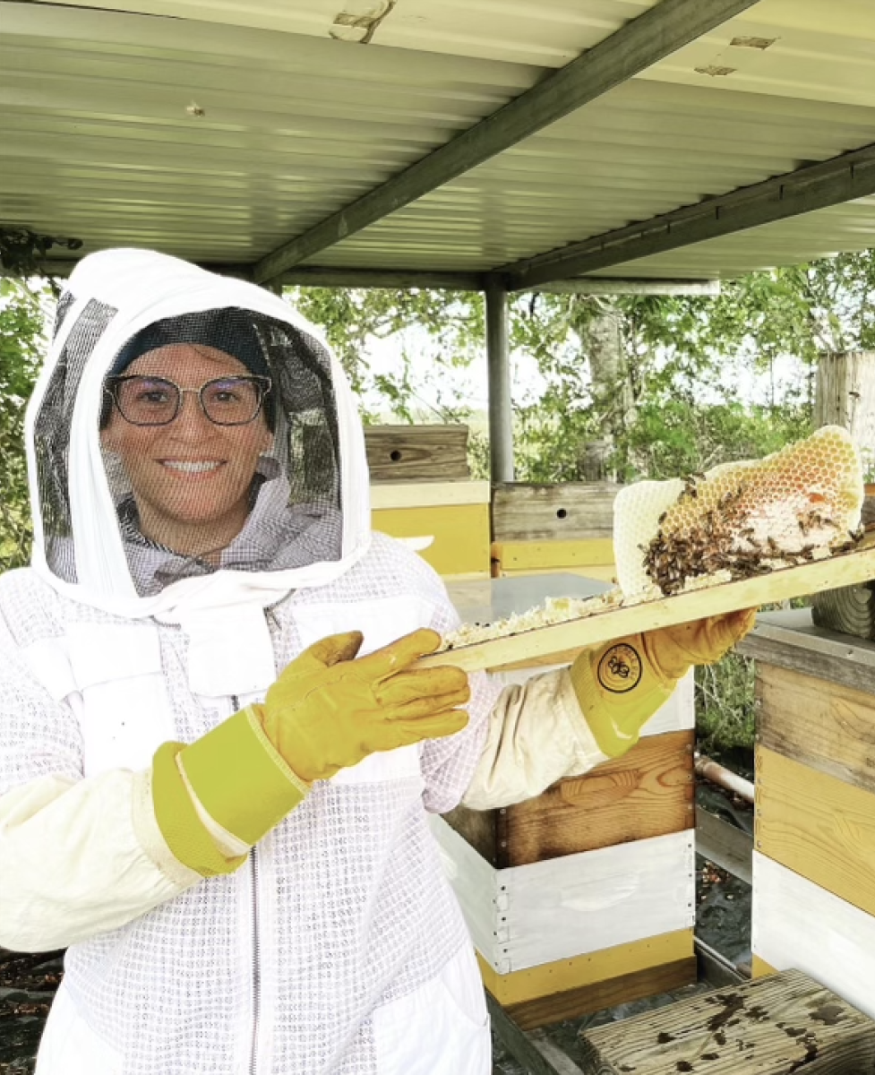 Ms. Daisy Ngo poses with a honeycomb.