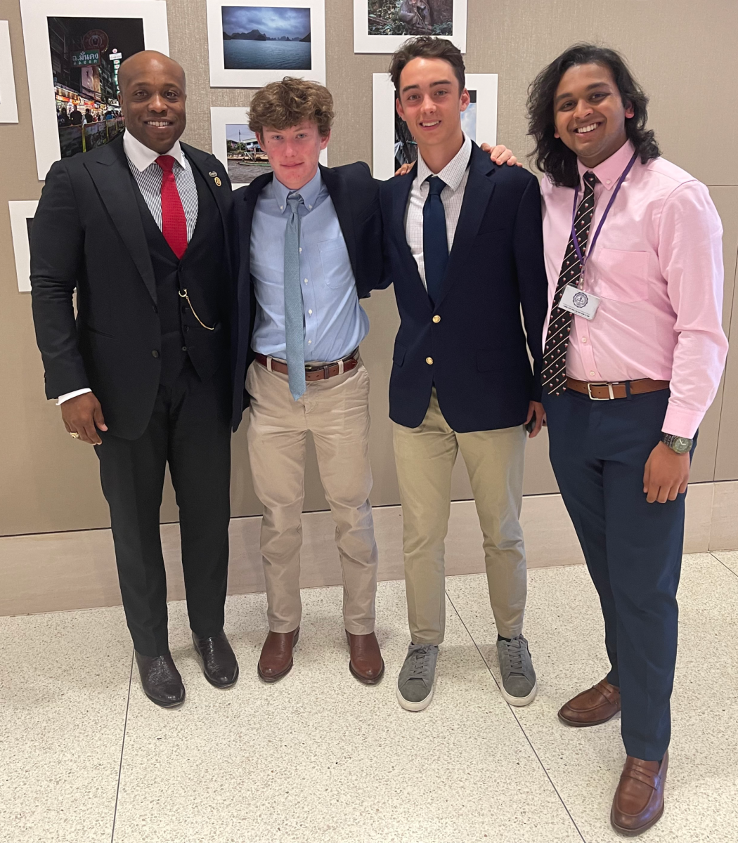 Journalism students Matthew Berman '25, Hudson Holton '26, and Eshaan Mani '24 meet with Senator Hunt before his talk with the senior AP Government class.