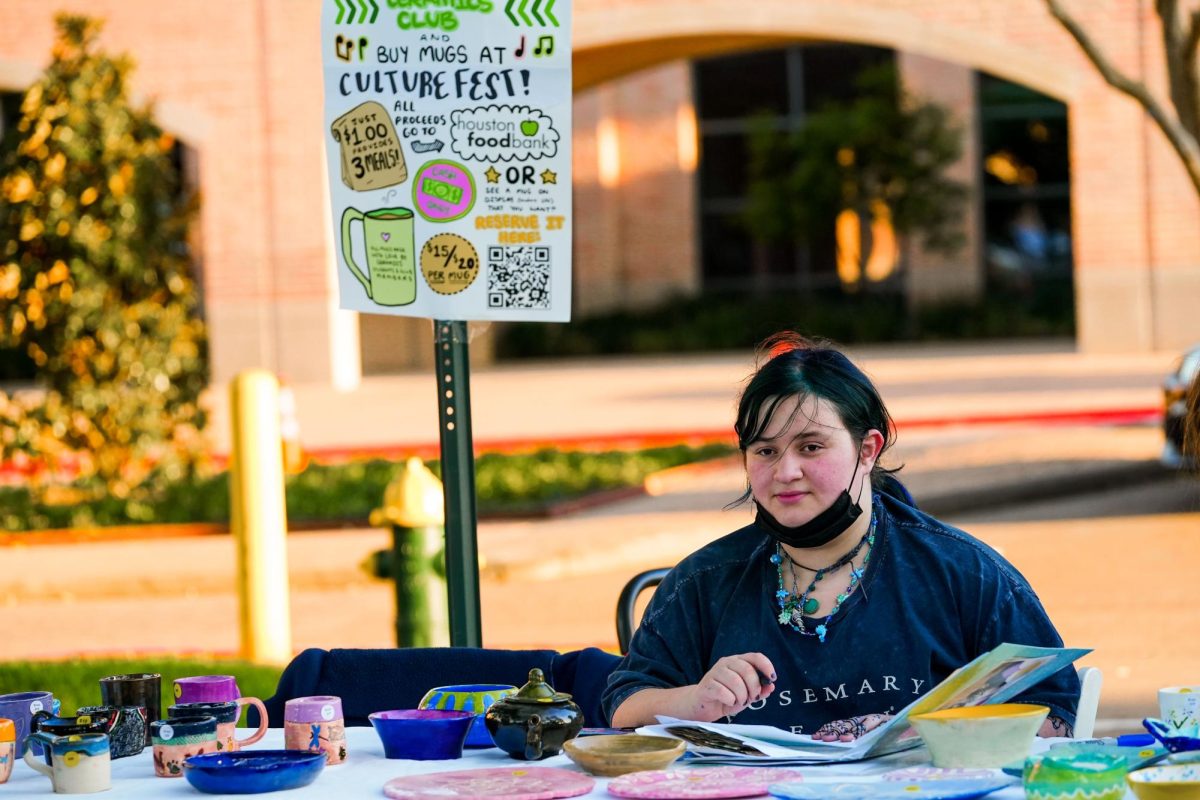 Sophomore Zoe Ostrosky sells mugs at Culture Fest.