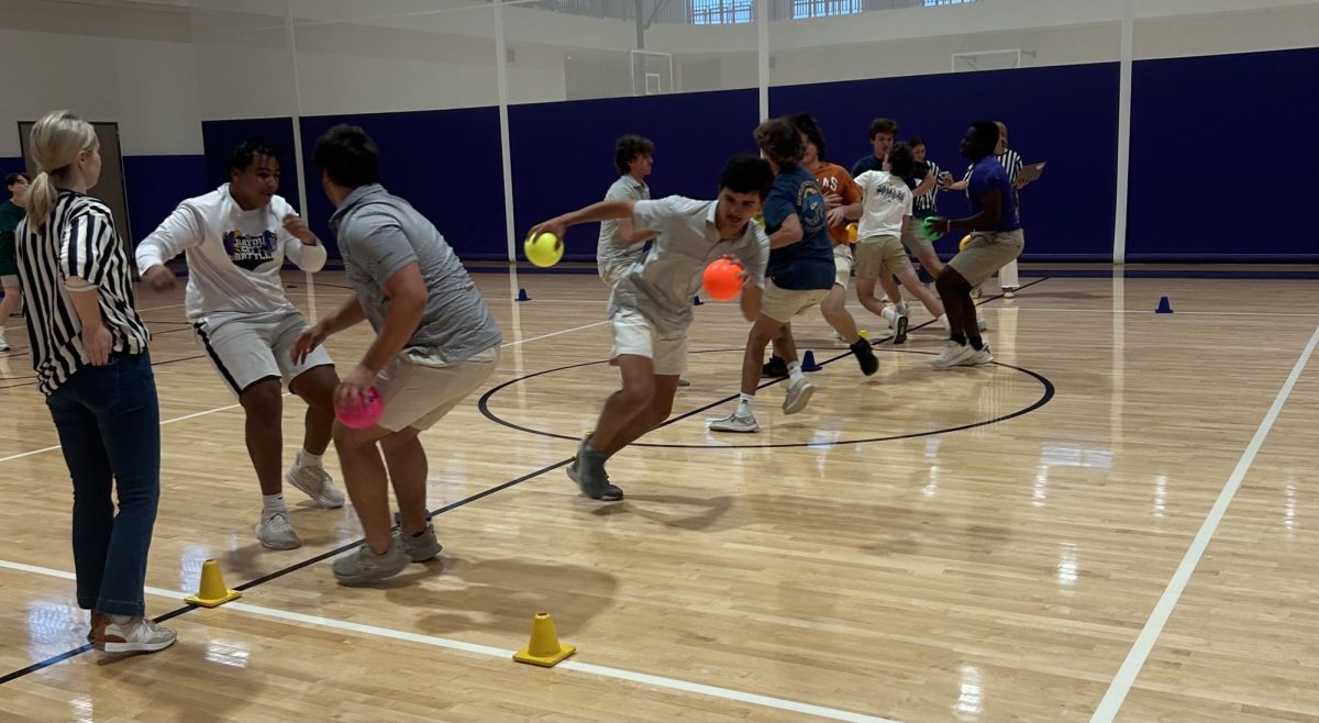 Junior Gus Griggs and his team head to the back of the court to start the dodgeball match. “Off the rip, I felt really good about our chances at winning. We started out strong, but just couldn’t finish the game,” said Griggs.