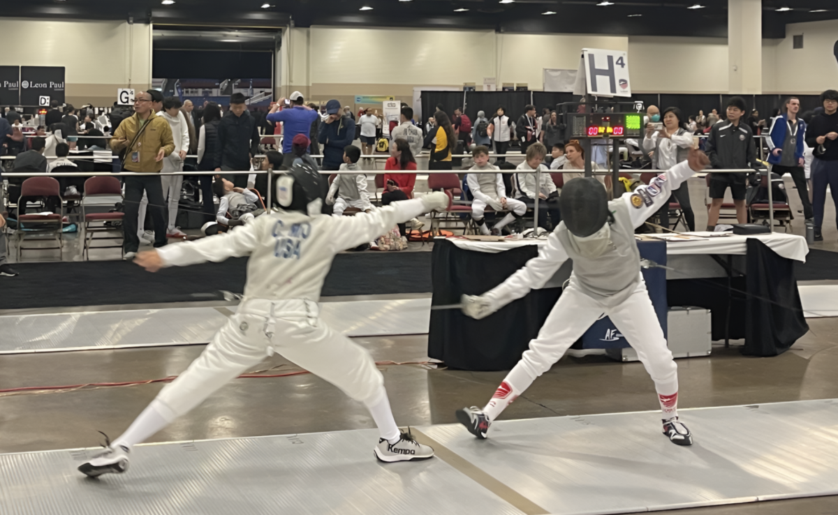 Chris Mo (left) uses his fencing skills against an opponent. 