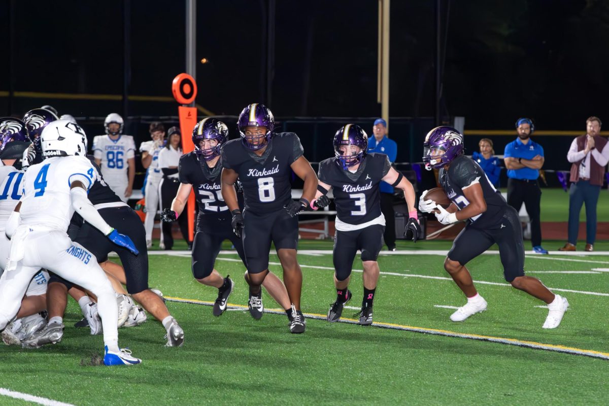 Running back Wayne Shanks carries the football as his teammates prepare to block in the Oct. 18, 2024 matchup against Episcopal High School.
