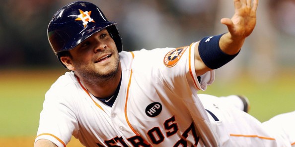 Altuve slides into a base during an early-career game.