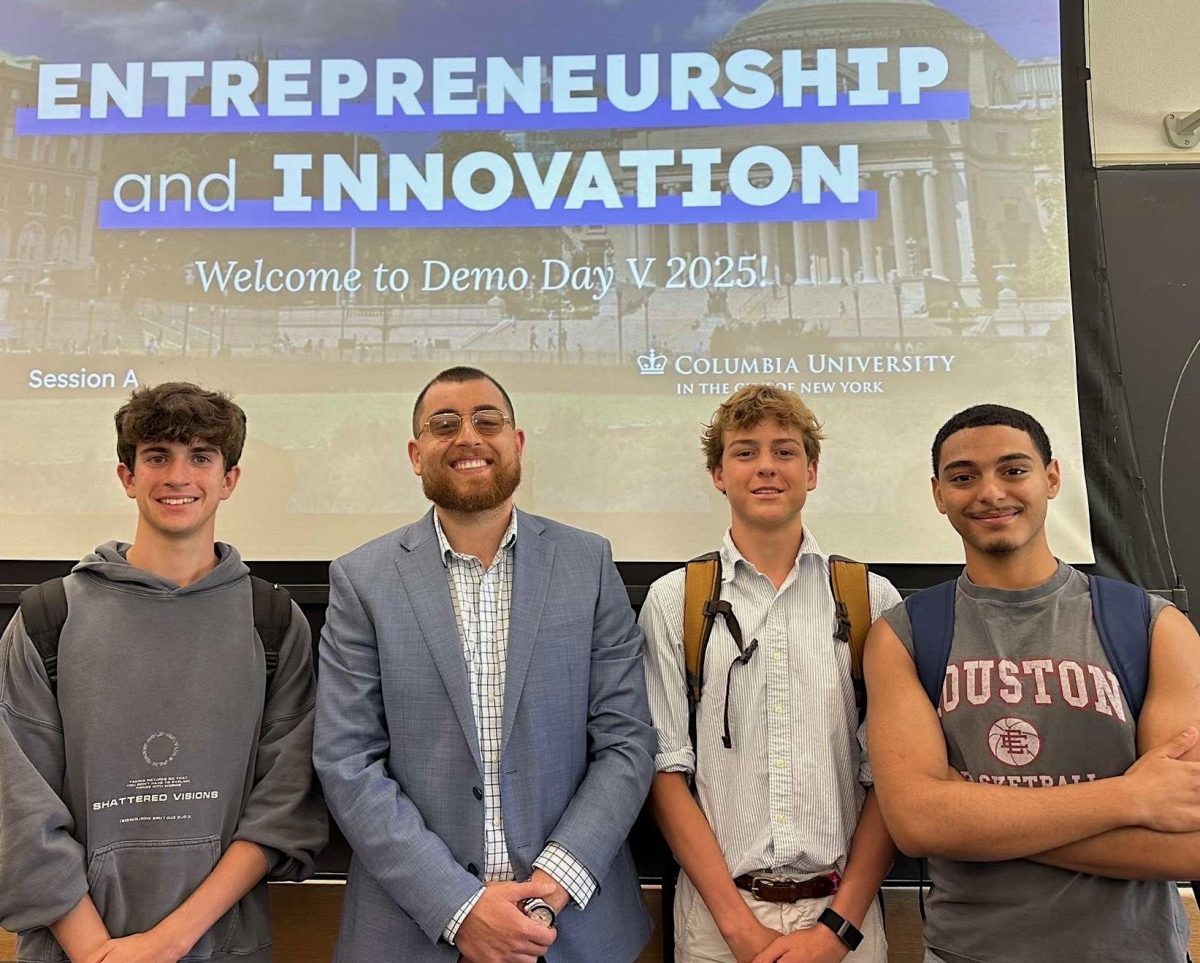 Junior Owen Kallop poses along with other students and Professor Daniel Ahmadizadeh at a Columbia Entrepreneurship course. 

