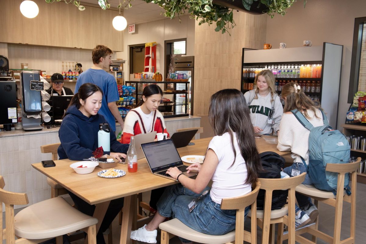 Students relax to study and socialize in the Lux Café. The café, which is adjacent to the senior center, is located in the Bowden Upper School building. “It’s the first place I go when I need a pick-me-up between classes,” junior Maya Bernal said.
