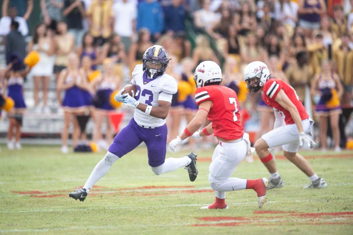 Junior Wayne Shanks runs a play at the 2025 matchup against St. John's. From being a new addition to the lineup to having a monumental 50 touchdowns and running a total of 1,579 yards, Shanks's presence on the field has been hard to miss. “It’s a huge blessing for sure, and I’m very grateful for being able to play at Kinkaid this year,” Shanks said.