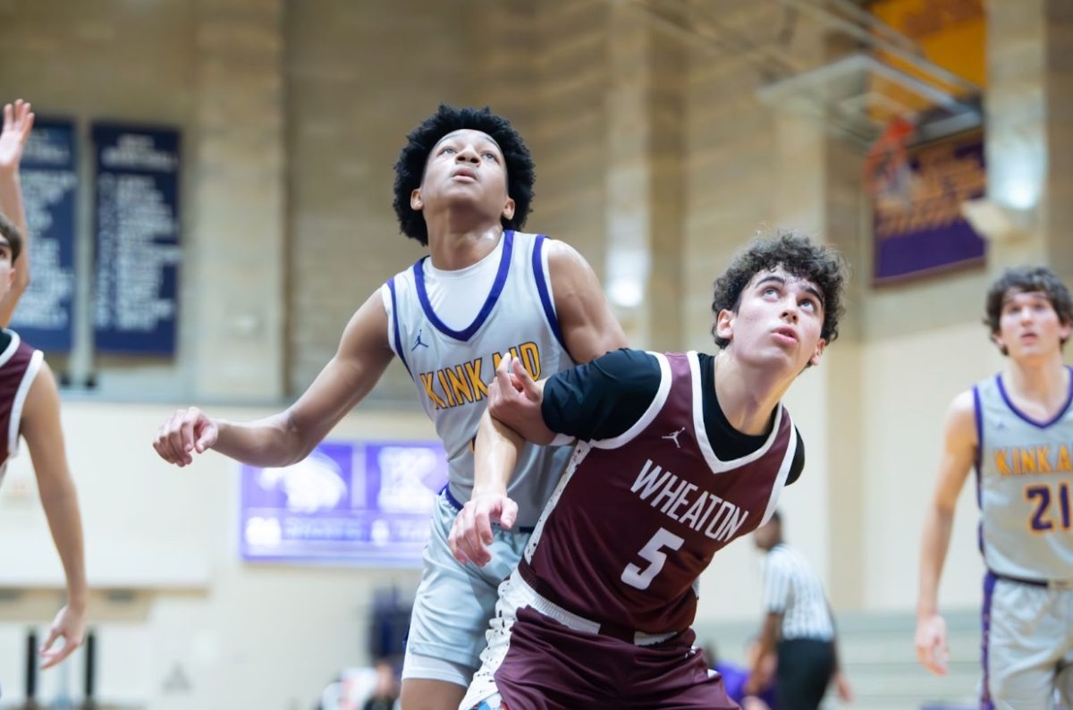 Junior Maddox Davis fights for a rebound in a heated matchup against Wheaton Academy from Chicago. “It was really cool to play a team from Chicago, and I was glad we could get a win,” said Davis after a 64-48 win. 