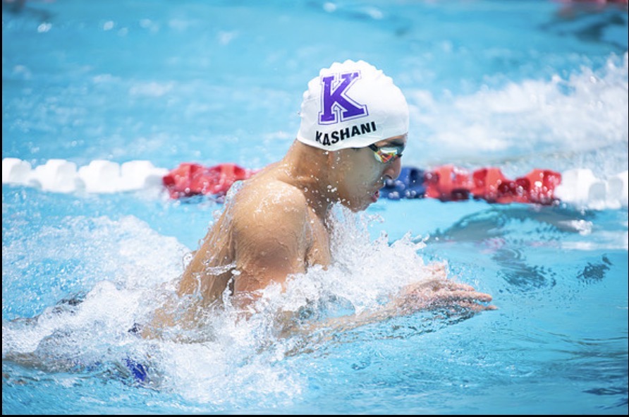 Freshman Kameron Kashani races in the boys' 100-yard breaststroke at the South Zone Championships, driving forward with a steady pace toward the finish.