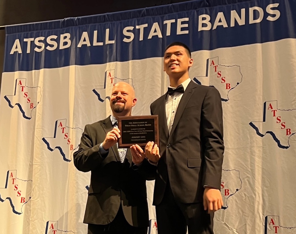Senior Jeremy Guo accepting a scholarship from the Association of Texas Small School Bands for four consecutive years of placement to its All-State Band.