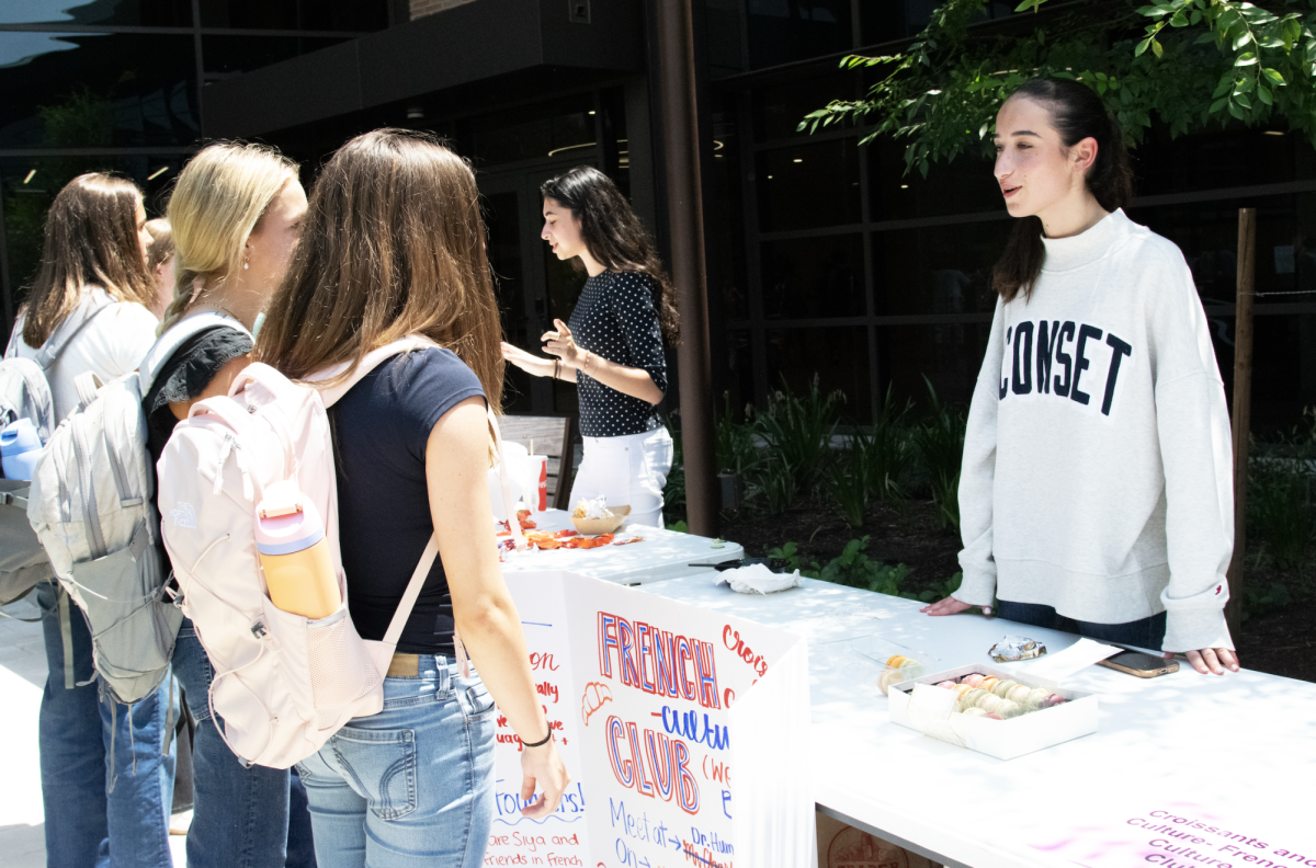 Looking to expand the French Culture Club, sophomore and founder Mia Pliskin talks with sophomores Devon Famulare and Georgia Burba during Belonging Week about getting involved. She shared information about the club and encouraged students to join and explore French culture with tasty macarons. “You don’t have to be fluent in French to join. It’s a fun way to learn about the culture,” Pliskin said.